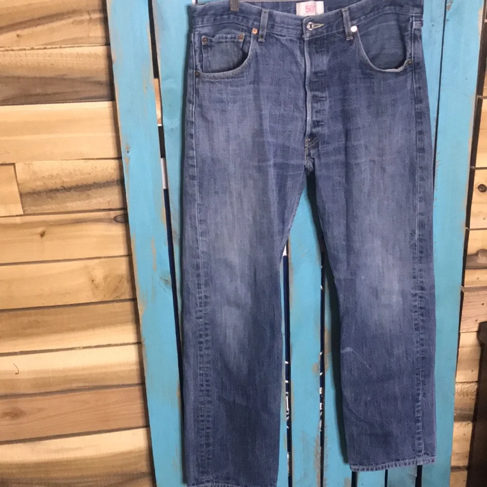 Levi’s 501 button fly Jeans size 35x28 (tag size 36x34) lightly distressed